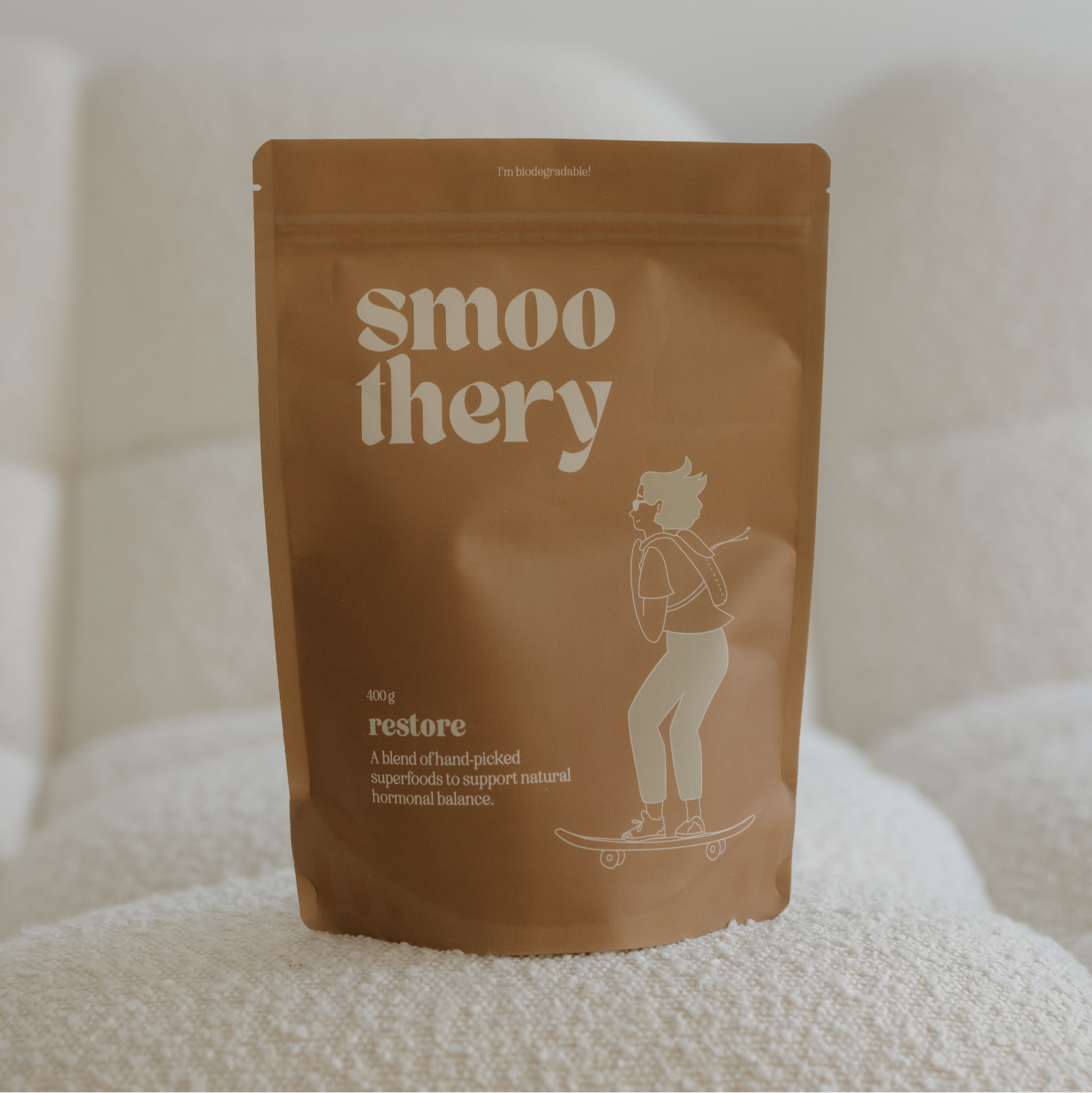 Brown package with 'smoothery' branding on a white surface